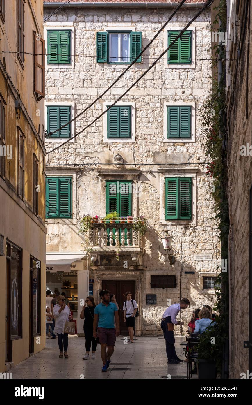 Pedestrians and Waiter Outside Restaurant in Pedestrian Zone, Split, Croatia Stock Photo