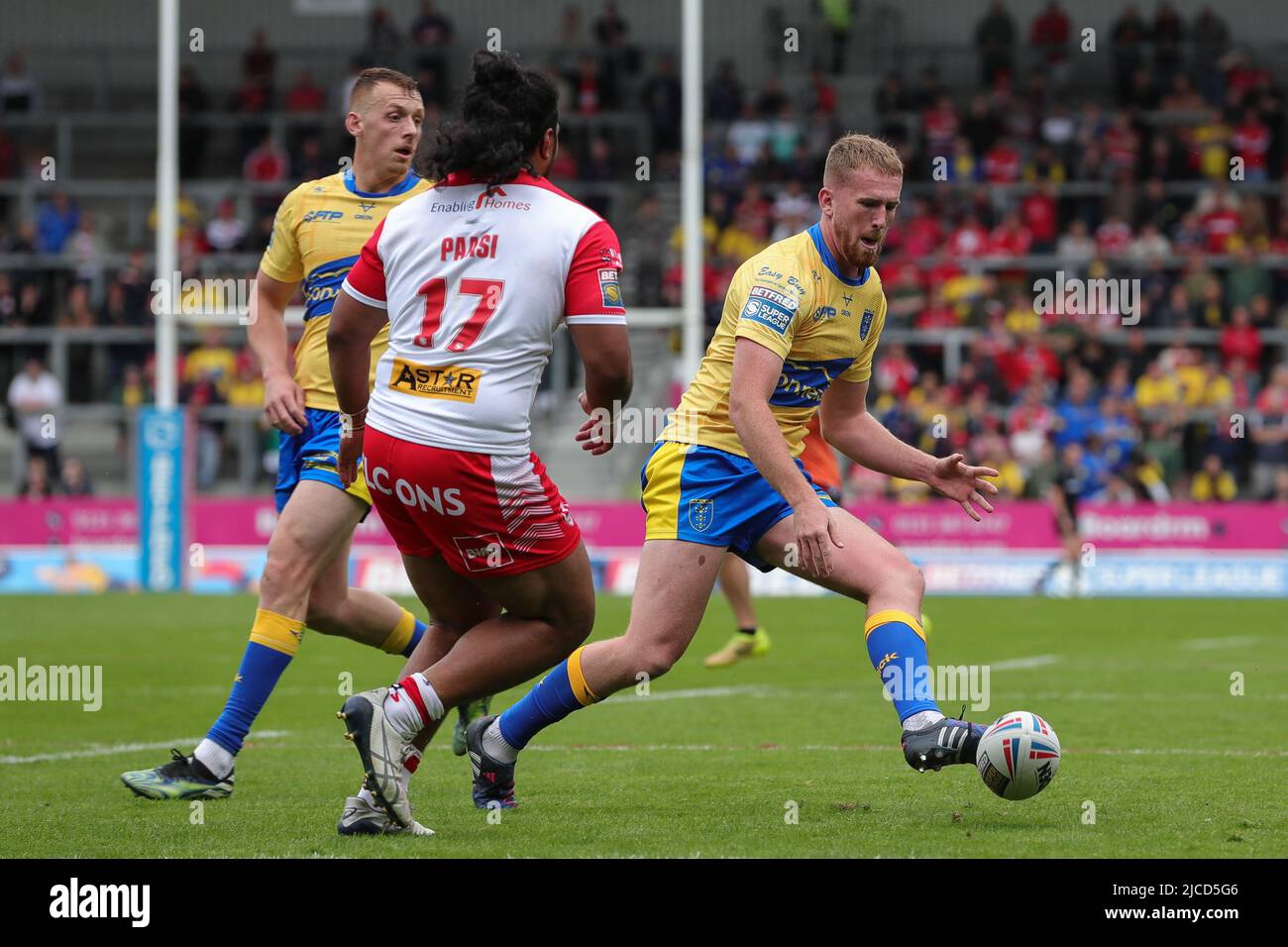 Rowan Milnes 21 of Hull KR kicks the ball forward during the second