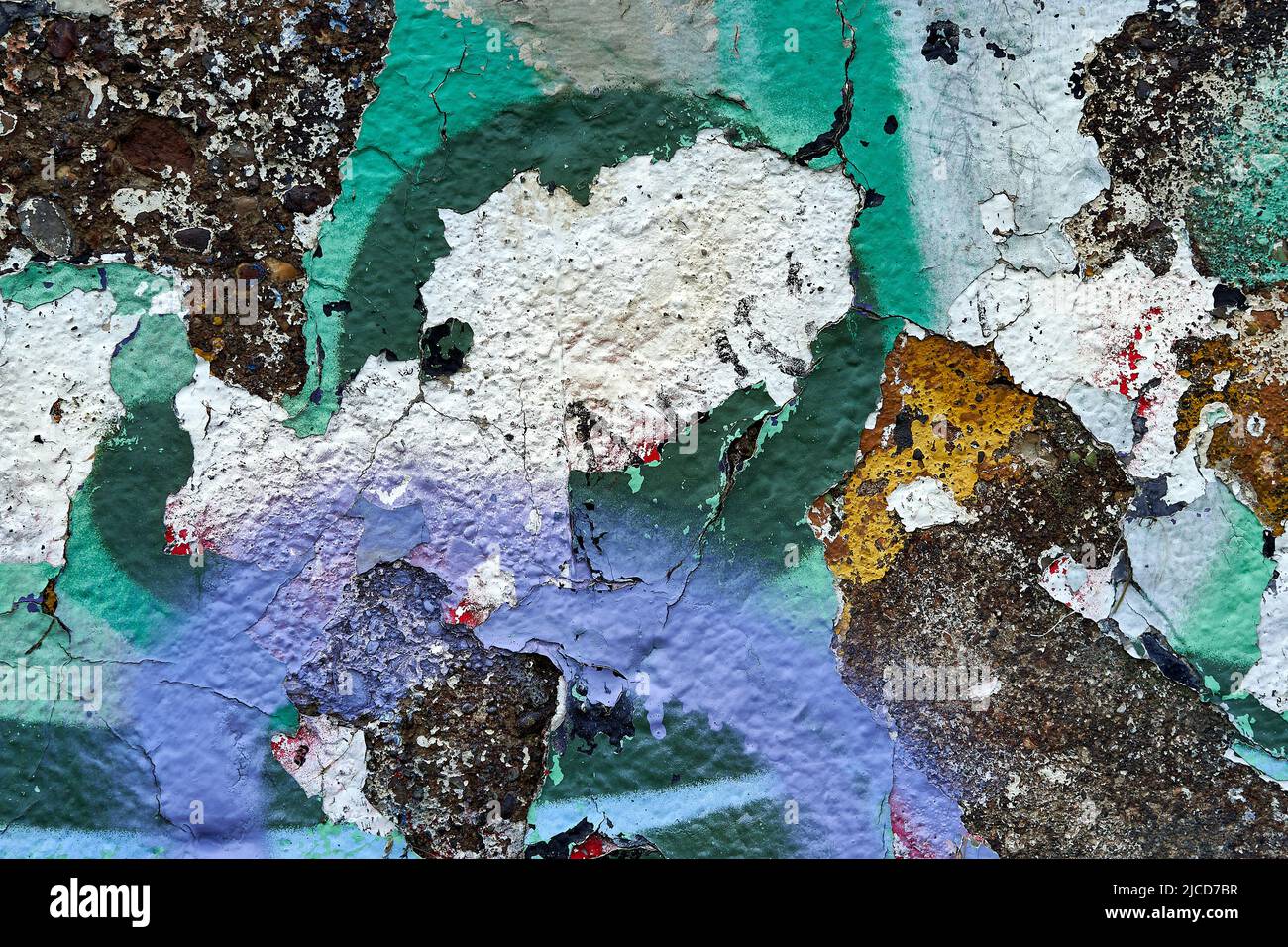 detail of old wall with colorful paint peeling Stock Photo