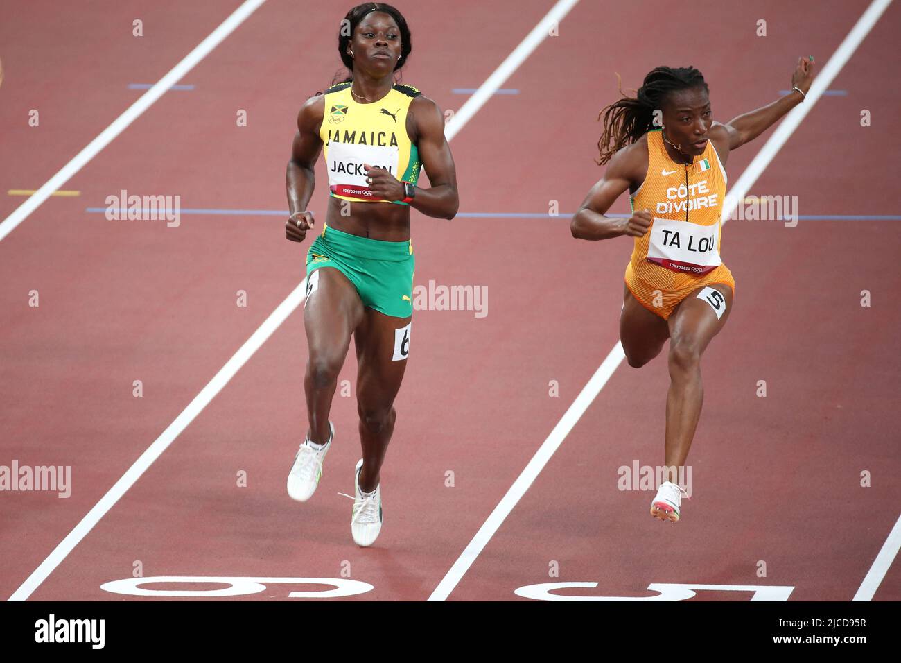 JULY 31st, 2021 - TOKYO, JAPAN: Shericka Jackson of Jamaica and Marie-Josee Ta Lou of Ivory Coast in action during the Women's 100m Semi-Finals at the Stock Photo