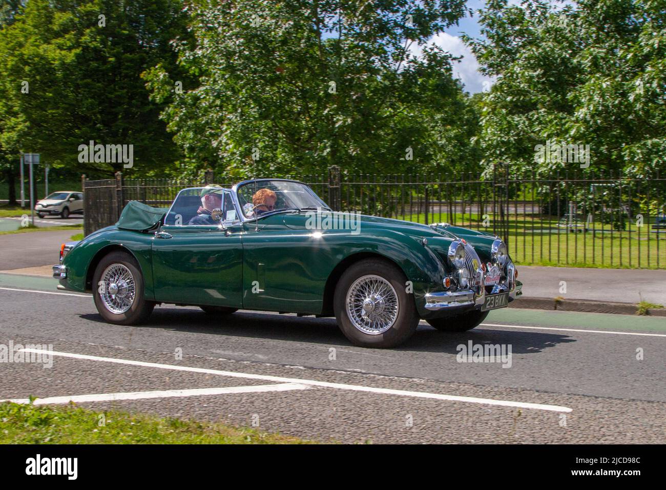 1961 60s sixties green Jaguar XK 3442cc petrol; automobiles featured during the 58th year of the Manchester to Blackpool Touring Assembly for Veteran, Vintage, Classic and Cherished cars. Stock Photo