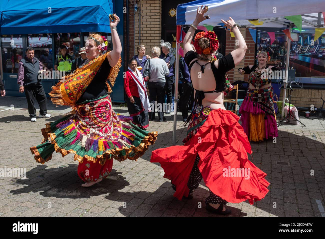 Belly dancers in colourful costumes performing at Victoria Day, an annual event in Aldershot town, Hampshire, England, UK Stock Photo