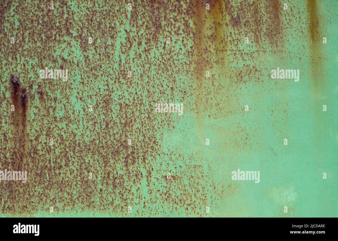 Green painted rusty iron sheet grunge texture Stock Photo