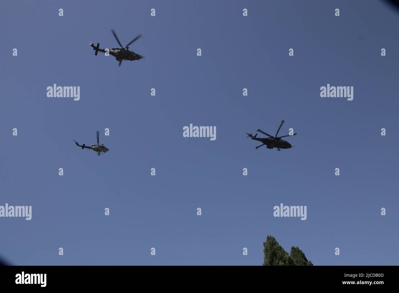 Italian military parade on 2 June. Group of helicopters flies over the Colosseum. Stock Photo