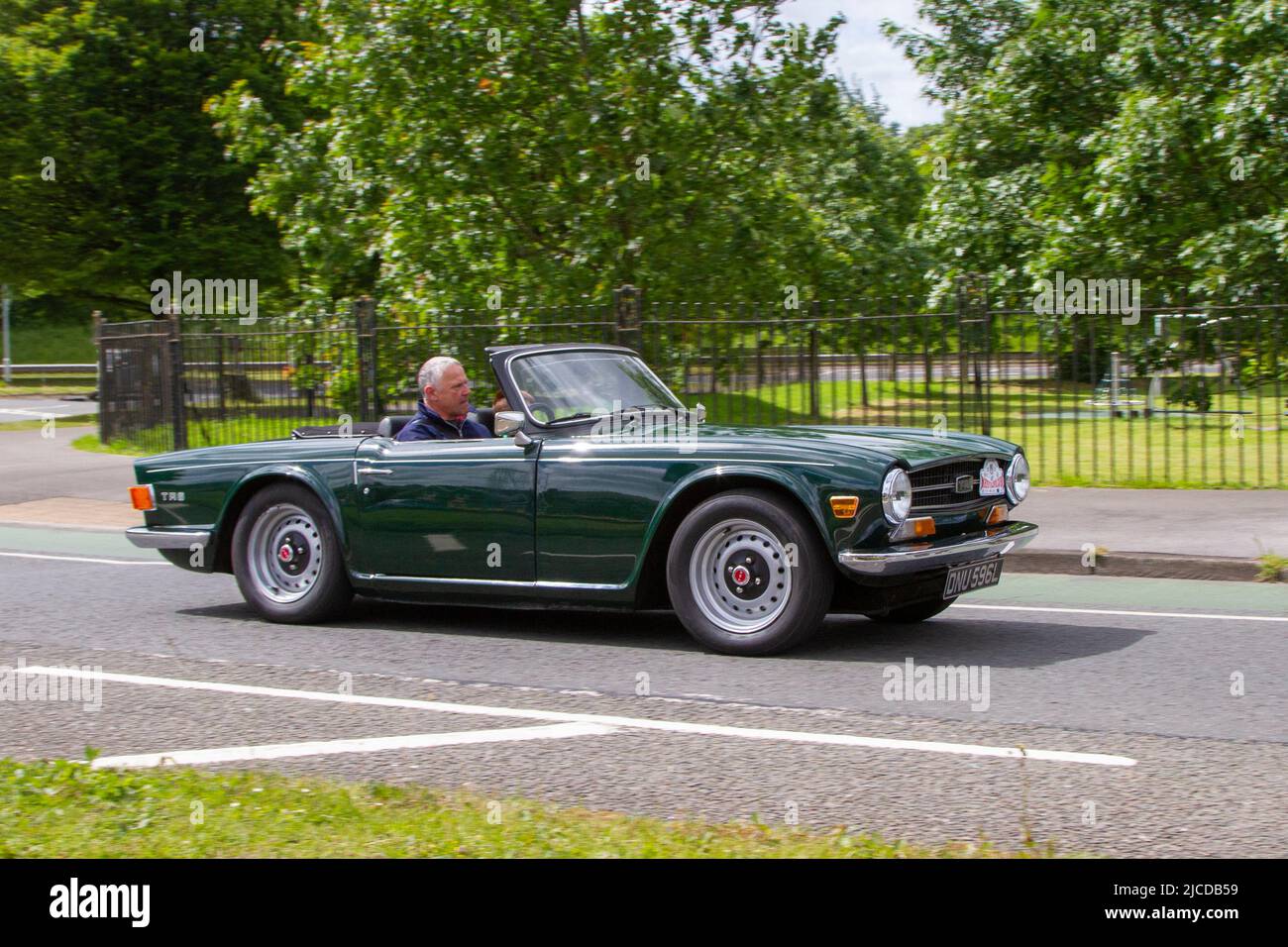 1973 70s seventies green Triumph TR6; automobiles featured during the 58th year of the Manchester to Blackpool Touring Assembly for Veteran, Vintage, Classic and Cherished cars. Stock Photo