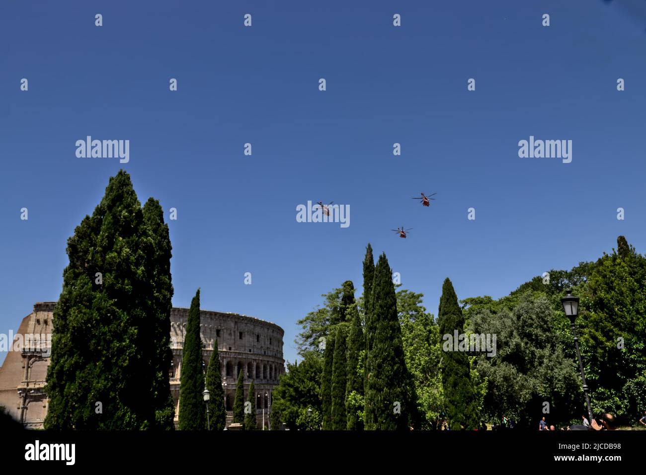 Italian military parade on 2 June. Group of helicopters flies over the Colosseum. Stock Photo