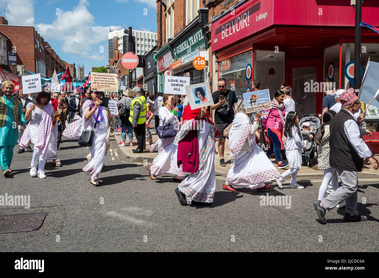 The Grand Parade at Victoria Day, an annual event in Aldershot, Hampshire, England, UK. Followers of Indian guru Sathya Sai Baba taking part. Stock Photo