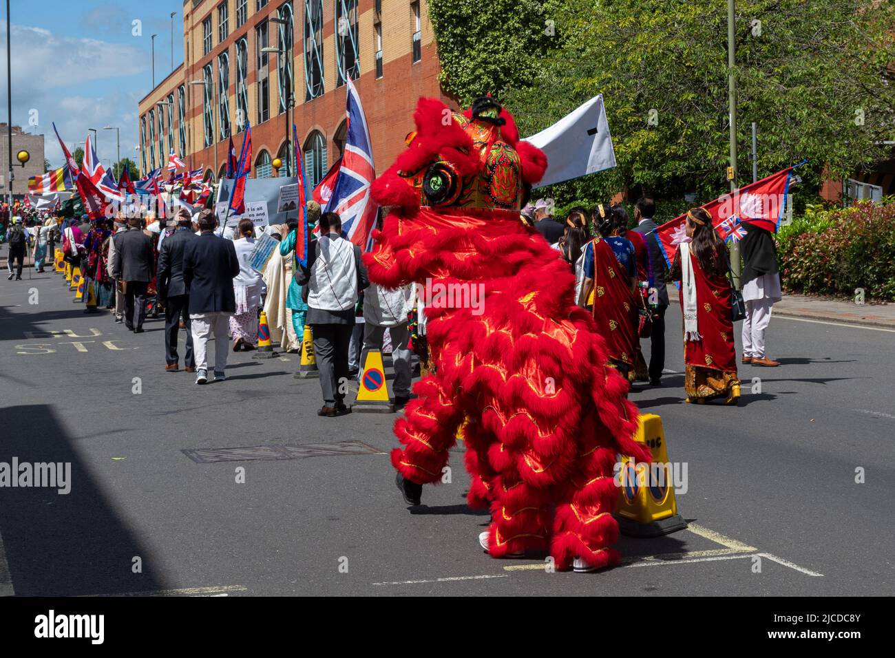 The Grand Parade at Victoria Day, an annual event in Aldershot, Hampshire, England, UK, with a Chinese Lion Dancer taking part Stock Photo