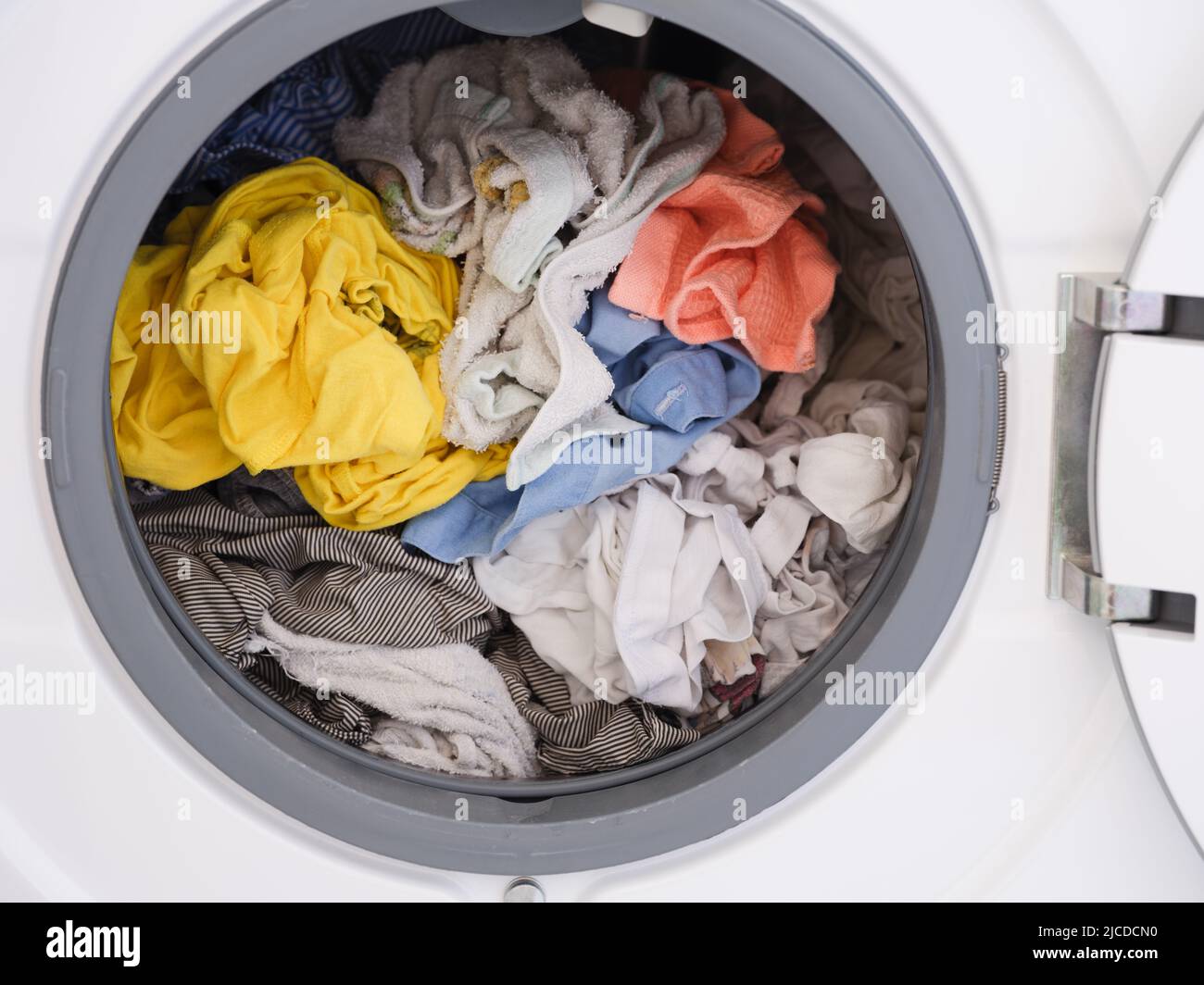 Laundry inside a washing machine. Close up. Stock Photo