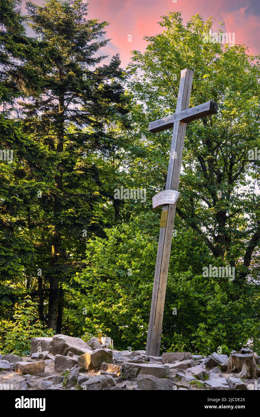 Lysica Mount peak with memorial cross near Swieta Katarzyna village and Bodzentyn at tourist path across Swietokrzyskie Mountains in Poland Stock Photo