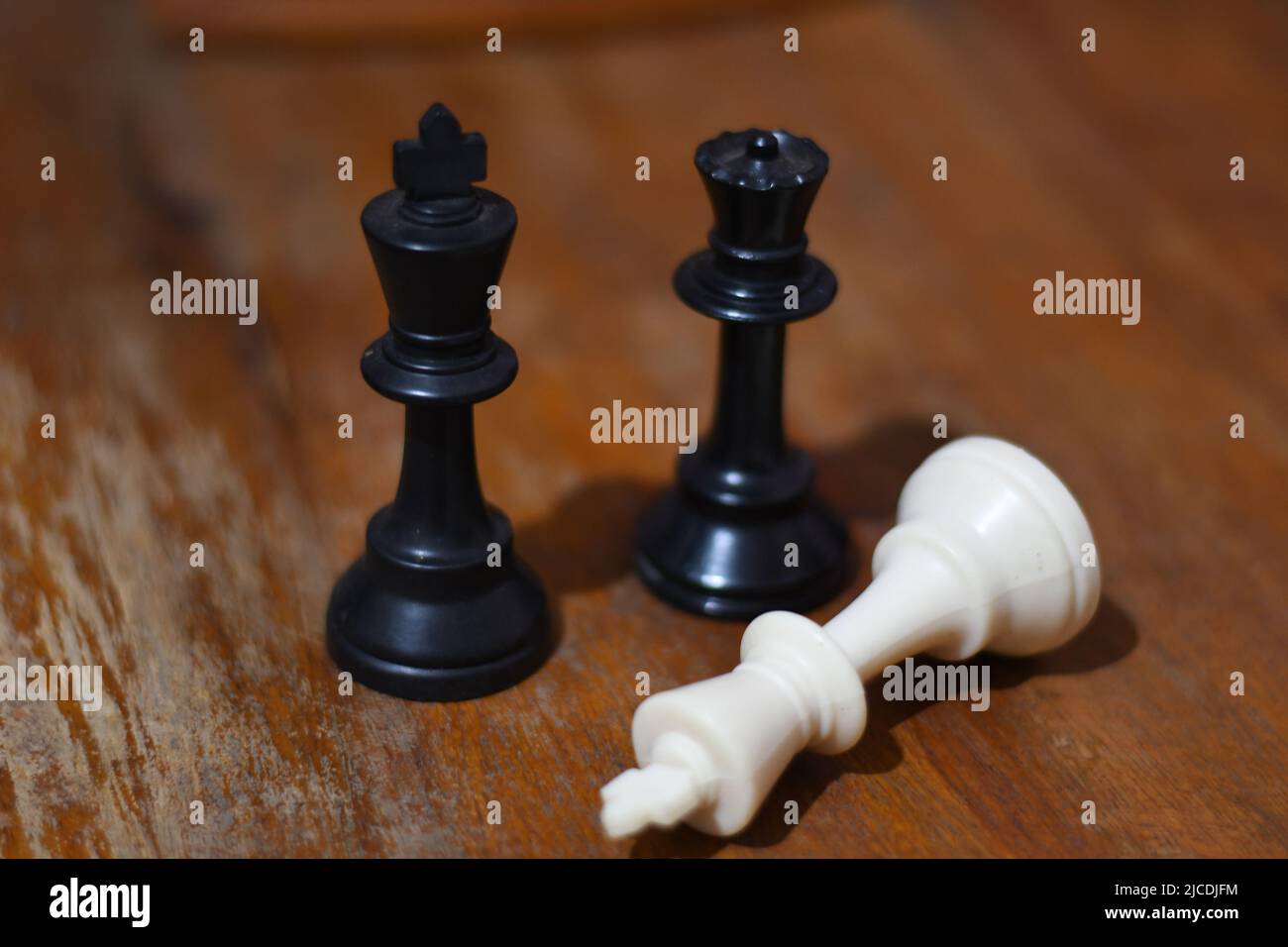 Powerful figures. Chess game concept of black wooden king and