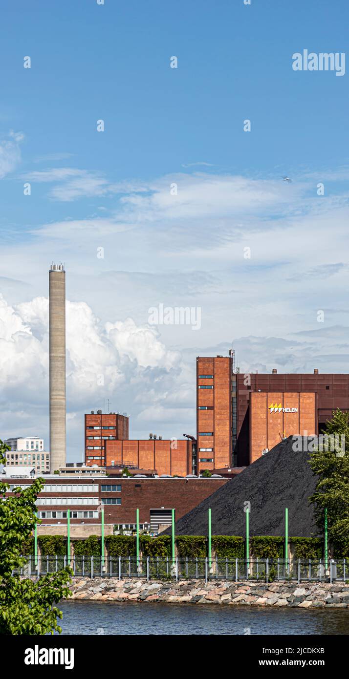 The Helen Ltd coal-fired power plant in Hanasaari, Helsinki, Finland. The coal bin is visible in the foreground. Room for text. Stock Photo