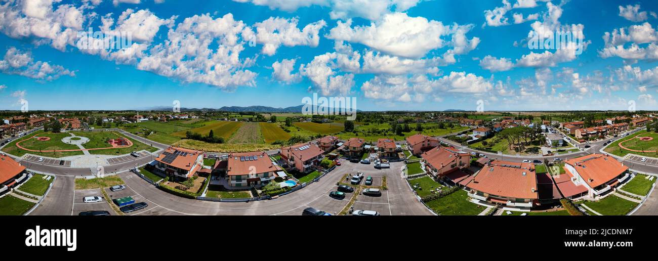 Panoramic aerial view of beautiful village across the countryside. Stock Photo