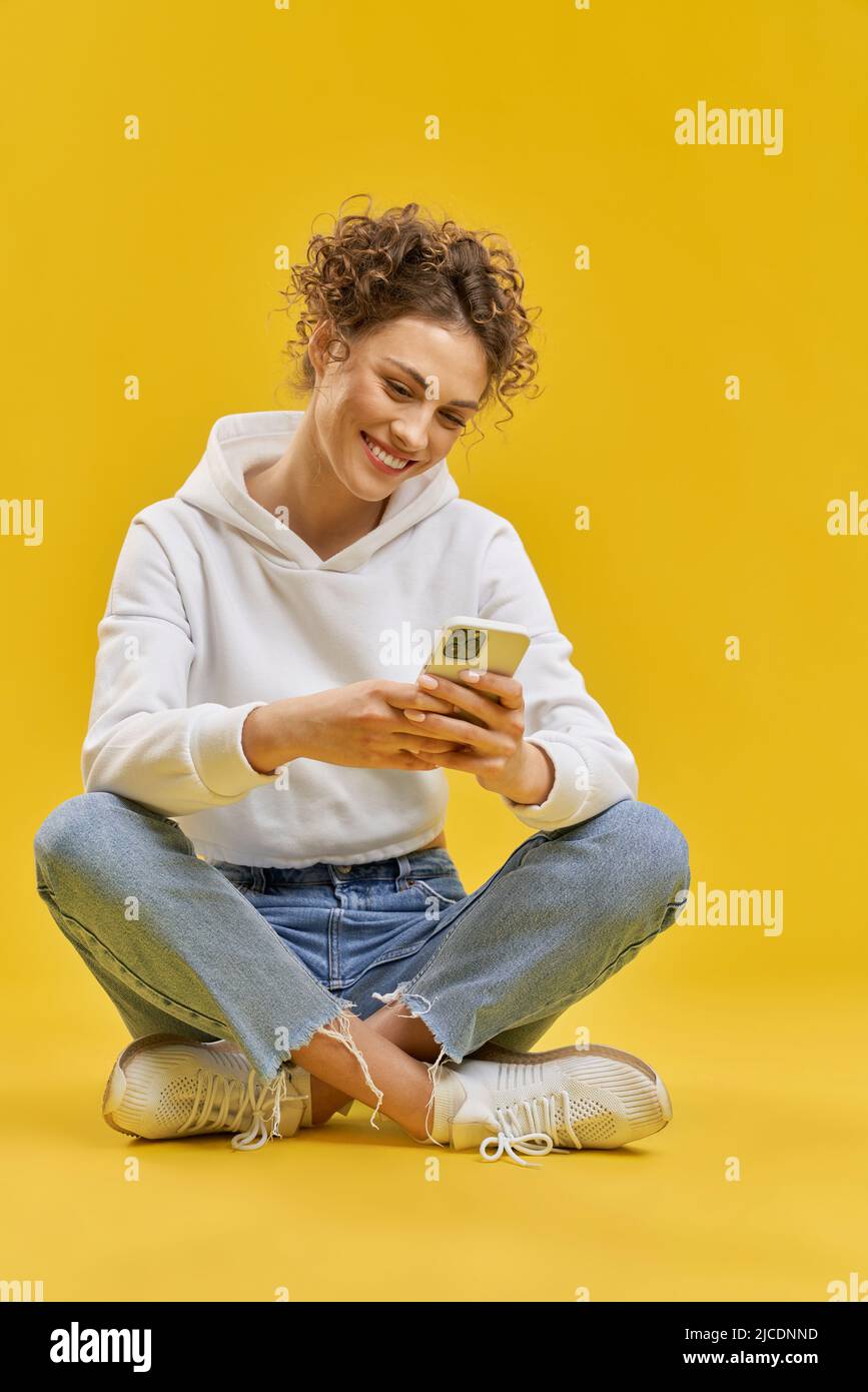 Girl sitting legs crossed isolated hi-res stock photography and images ...