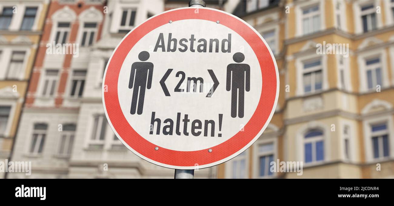 Sign 'Keep a distance of 2 m' ('2 m Abstand halten' in German) Stock Photo