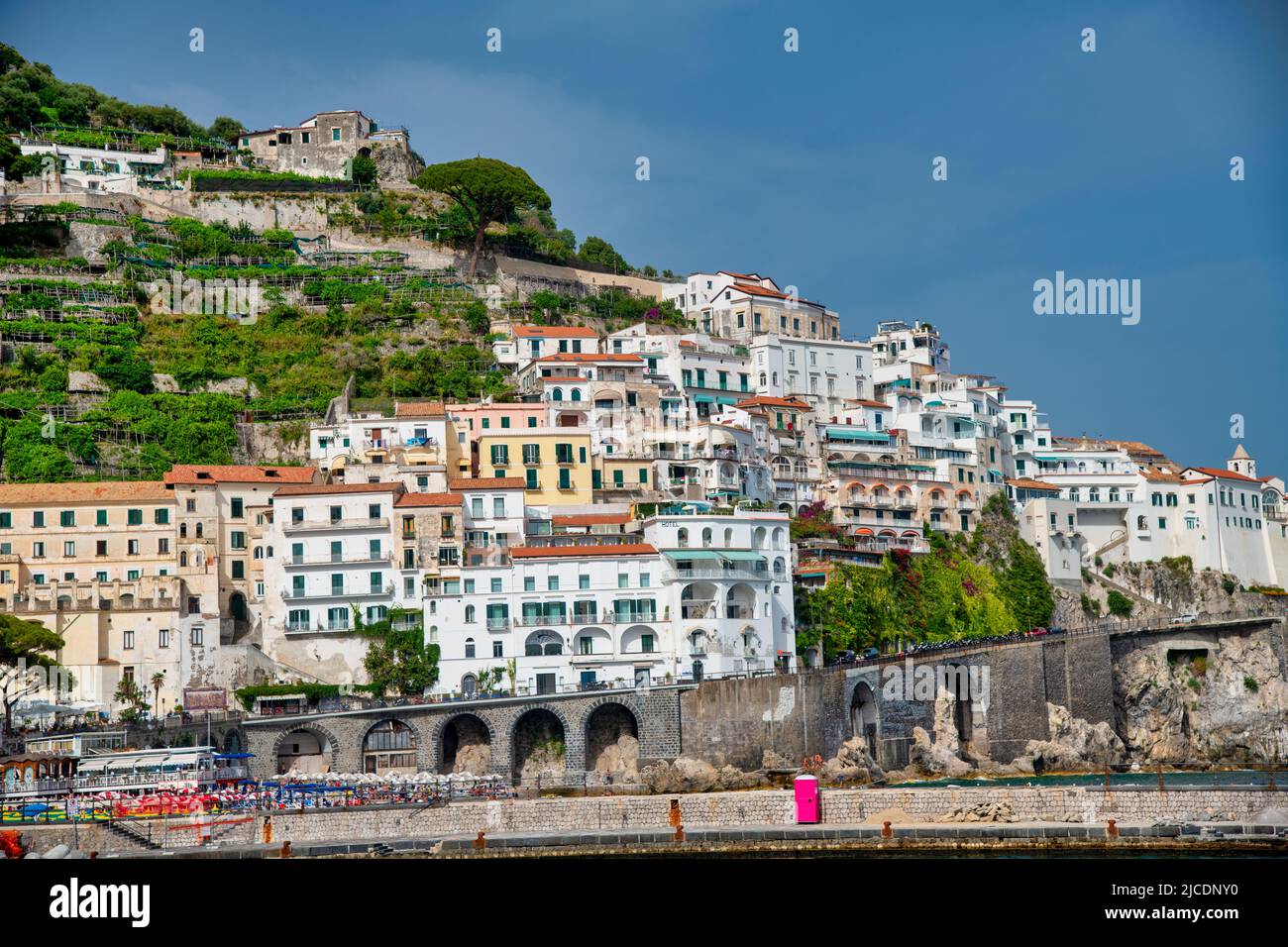 Positano, Italy - June 29, 2021: Town coastline and buildings on a sunny day. Stock Photo