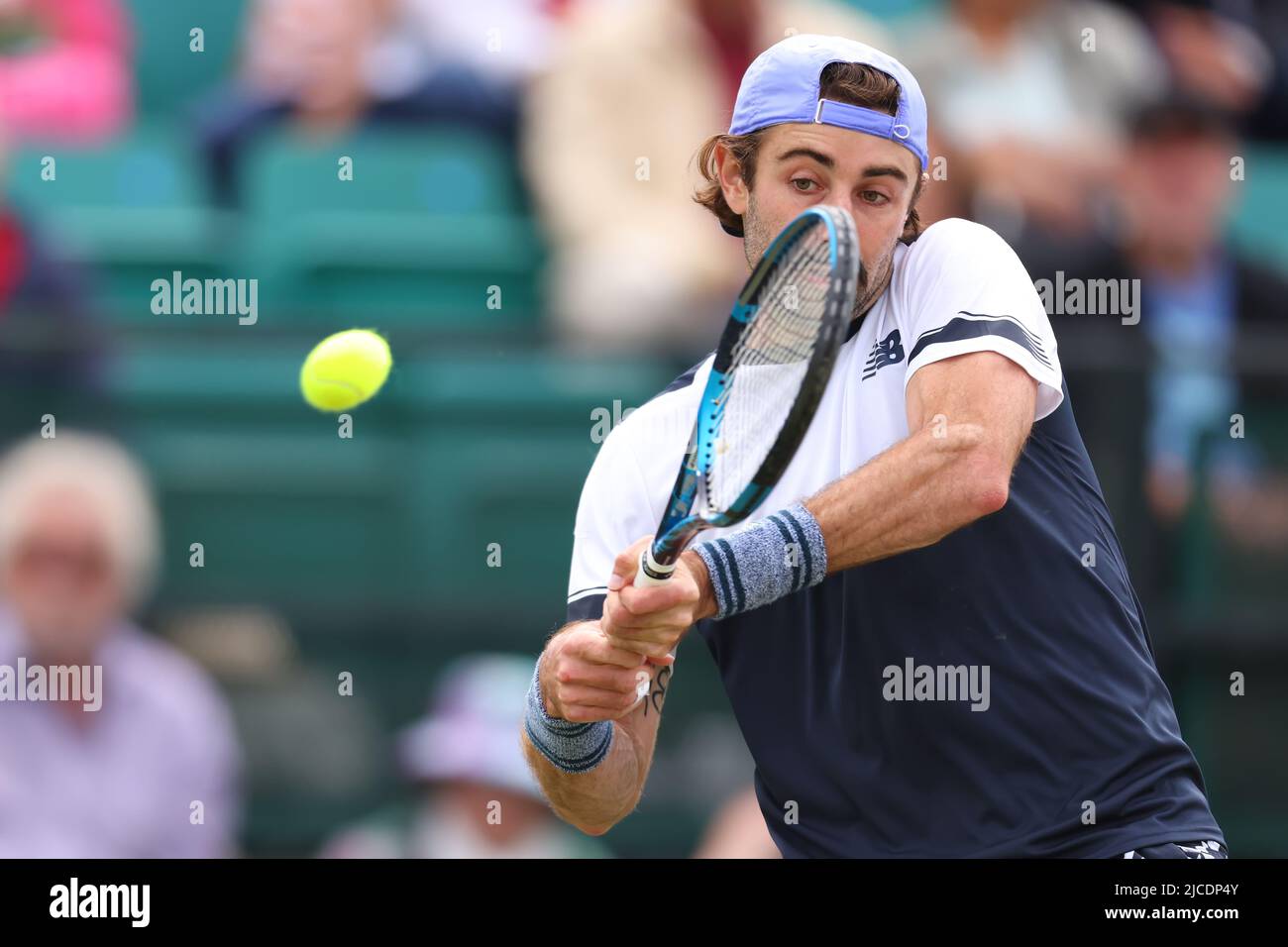 12th June 2022;  Nottingham Tennis Centre, Nottingham, England: Rothesay Open Nottingham Lawn Tennis tournament; Jordan Thompson  (usa) plays a backhand to Daniel Evans (gbr)  in the mens singles final Stock Photo