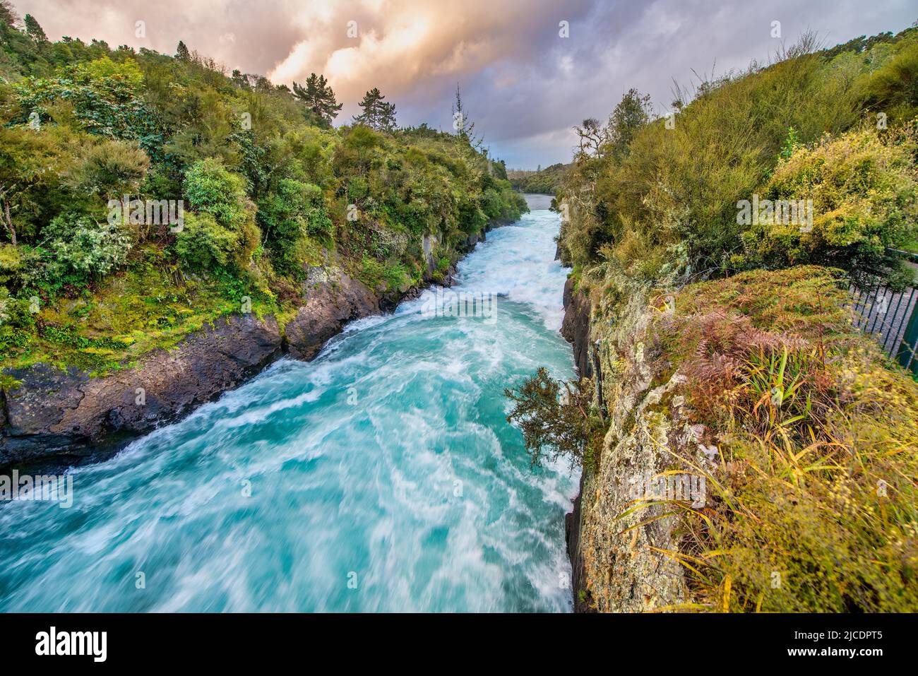 Amazing sunset colors of powerful Huka Falls, New Zealand. Stock Photo