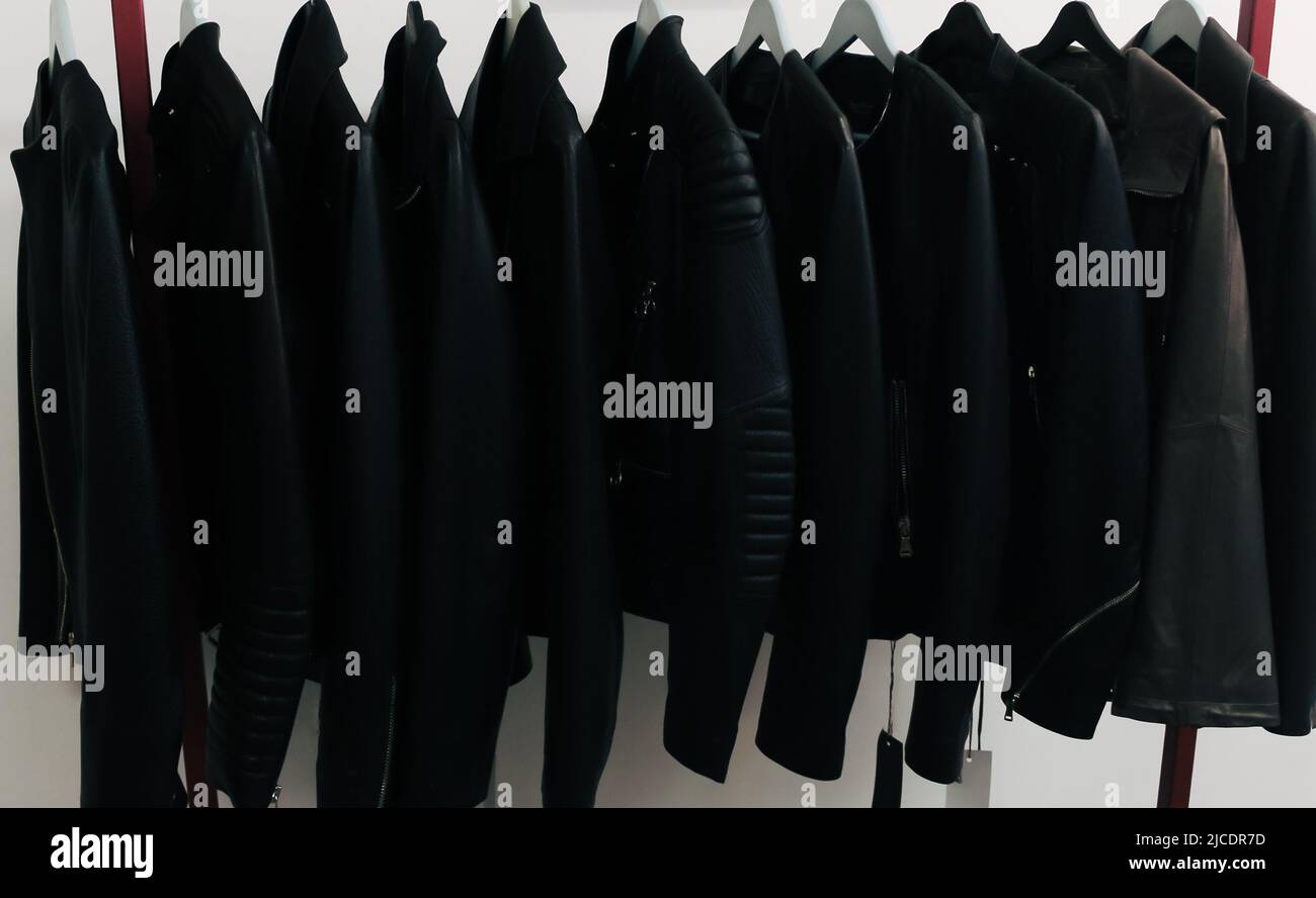 Collection of many new women’s leather spring jackets on hangers in the