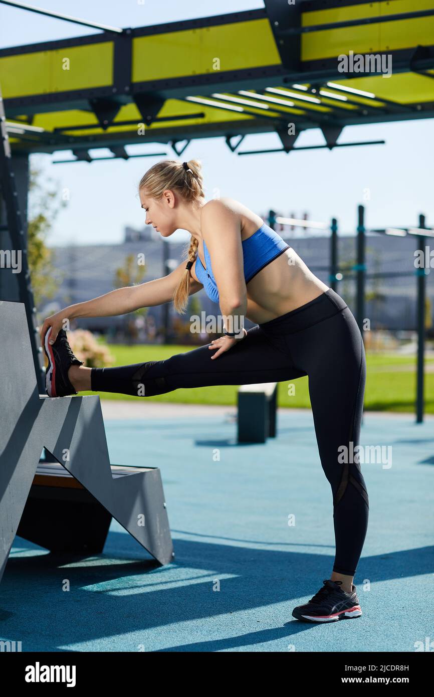 Shelf of work out equipment in modern gym. Yoga, classes