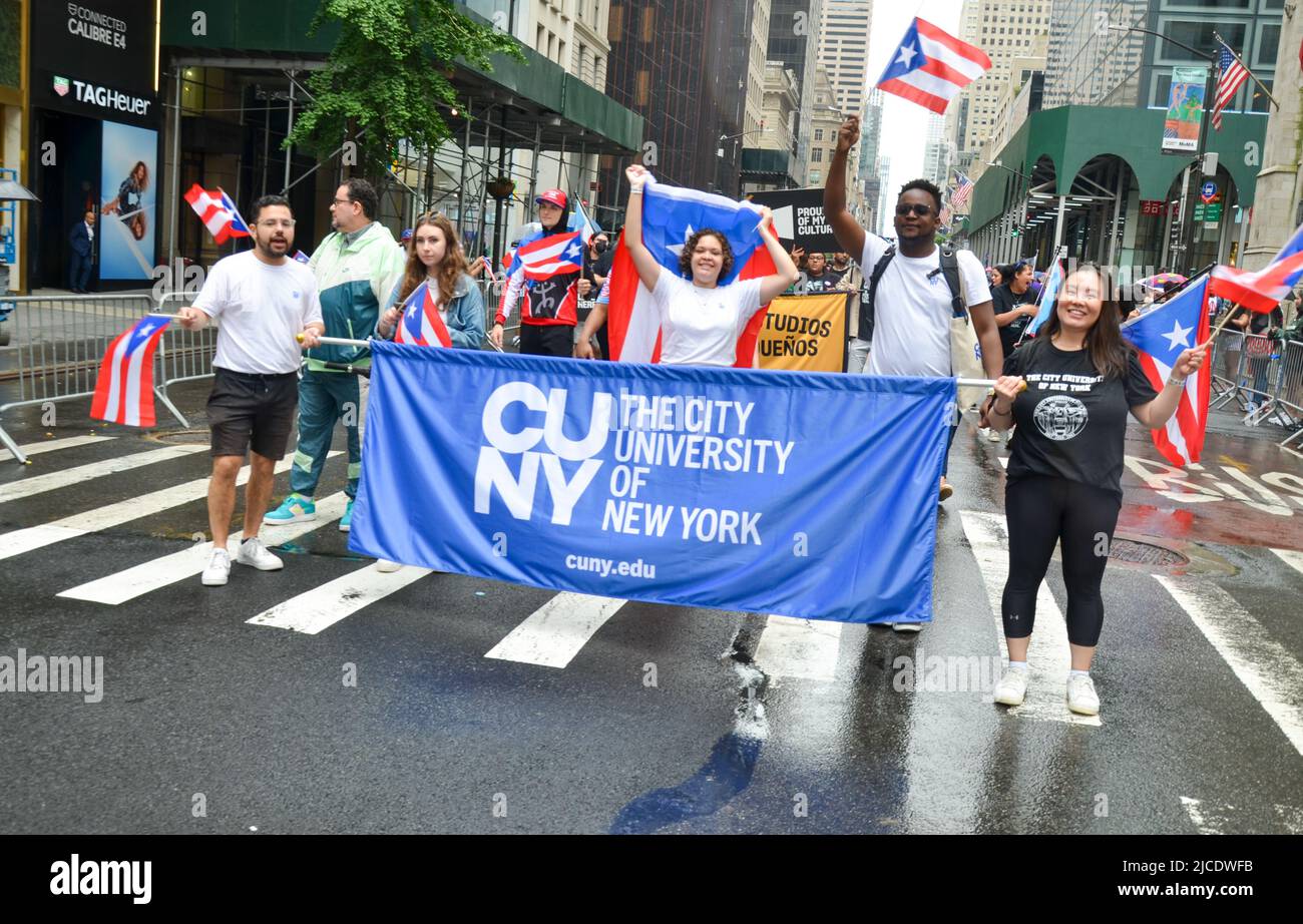 New York, United States. 12th June, 2022. The City University of New York (CUNY) marches up Fifth Avenue in New York City during the National Puerto Rican Day Parade, returning after a two-year-hiatus due to the pandemic, on June 12, 2022. (Photo by Ryan Rahman/Pacific Press) Credit: Pacific Press Media Production Corp./Alamy Live News Stock Photo