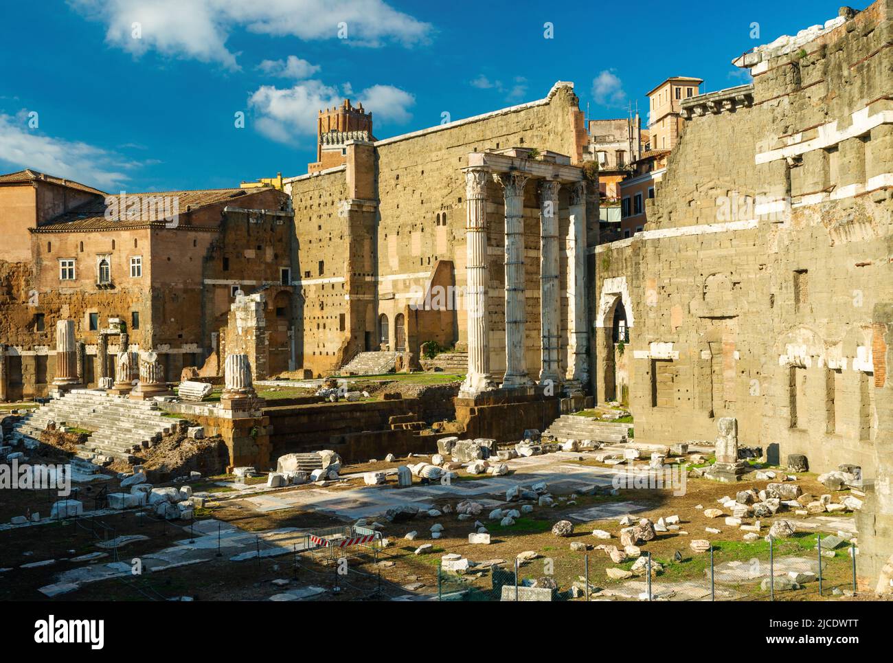 Ancient Forum of Augustus in Rome, Italy. Imperial Forums are famous historical landmarks of Rome. Scenery of ruins of Mars Ultor temple, old Roman bu Stock Photo