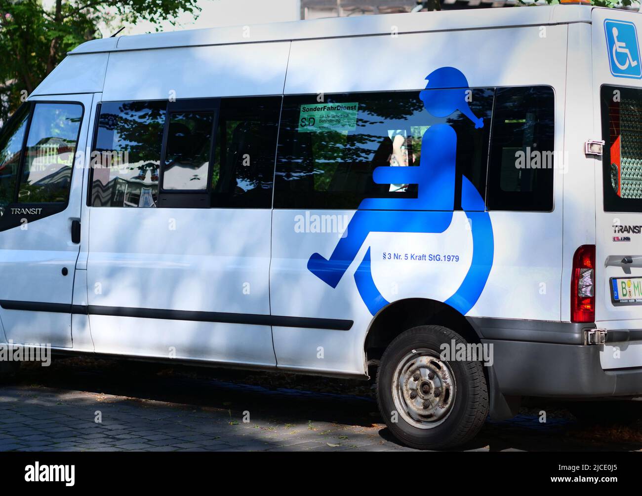 Berlin, Germany. 14th Sep, 2020. 14.09.2020, Berlin. A minibus in which disabled people are driven is parked in a street in front of a school. On the side of the vehicle is a pictogram showing a young wheelchair user. Credit: Wolfram Steinberg/dpa Credit: Wolfram Steinberg/dpa/Alamy Live News Stock Photo