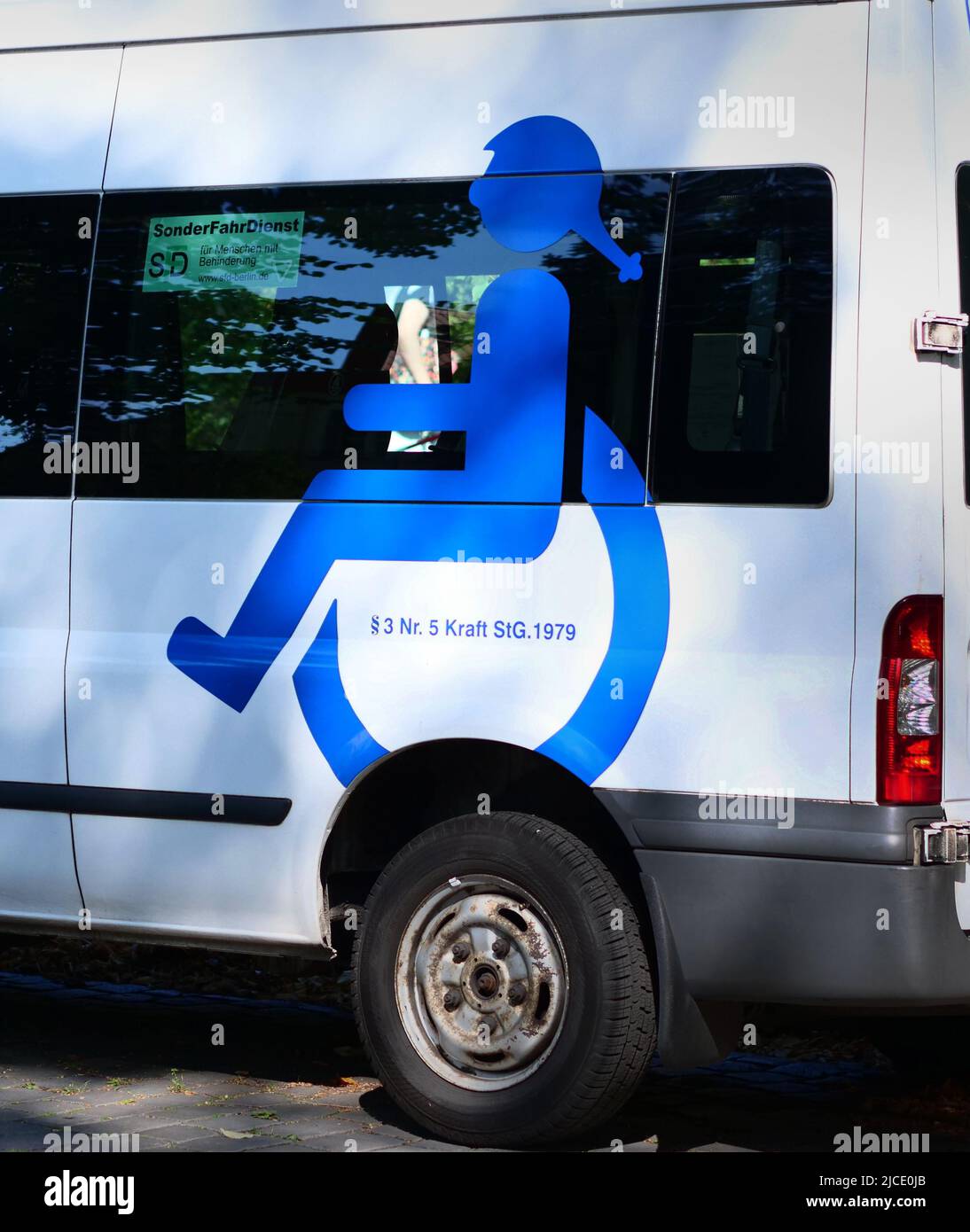 Berlin, Germany. 14th Sep, 2020. 14.09.2020, Berlin. A minibus in which disabled people are driven is parked in a street in front of a school. On the side of the vehicle is a pictogram showing a young wheelchair user. Credit: Wolfram Steinberg/dpa Credit: Wolfram Steinberg/dpa/Alamy Live News Stock Photo