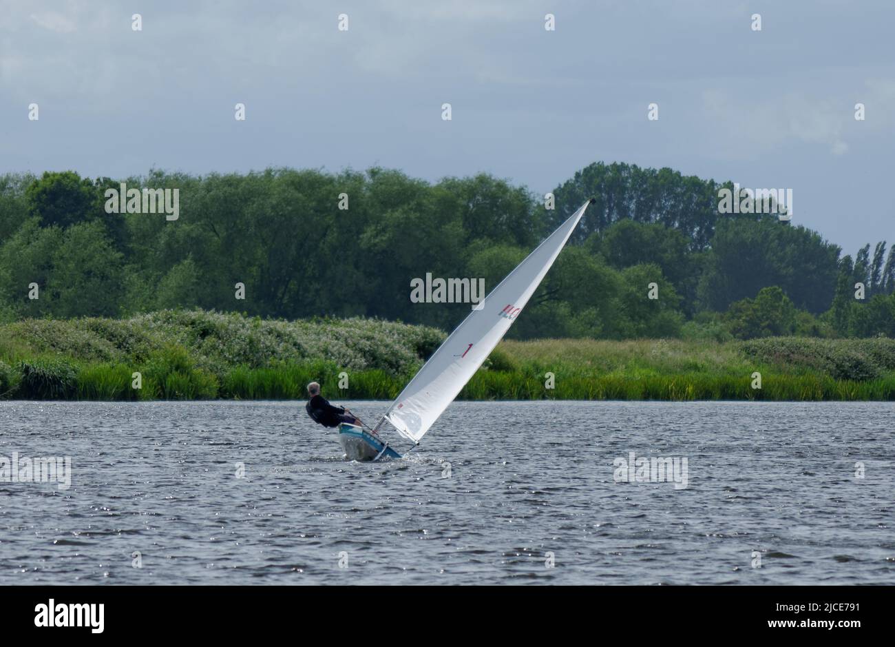 Sailor steers his boat on the River Trent, Nottingham, UK Stock Photo