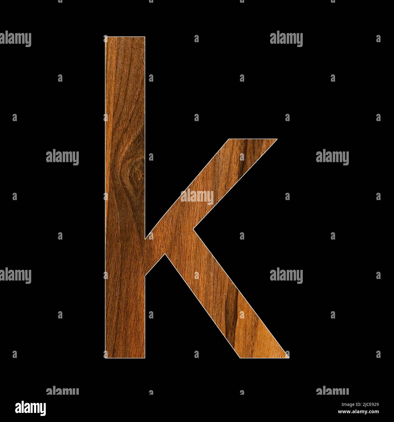 lowercase letter k - wood texture - black background Stock Photo