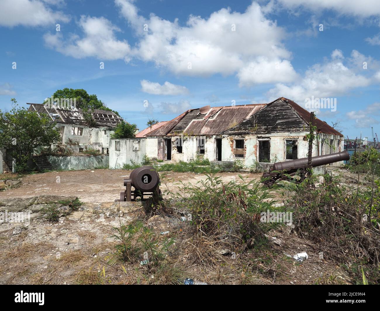 View of the old cannon and the derelict buildings at Fort James near St John's in Antigua Stock Photo