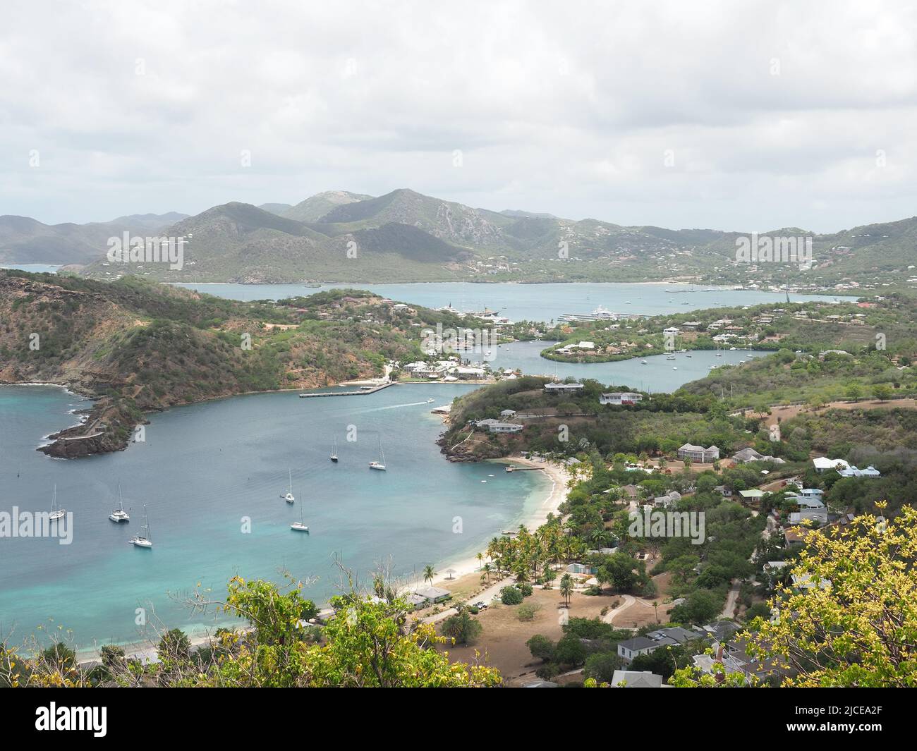 View from Shirley Heights Lookout in Antigua looking down on English Harbour and with Falmouth Harbour in the distant background Stock Photo