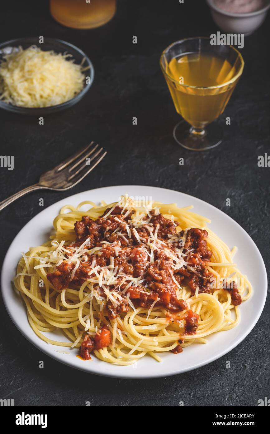 Spaghetti with bolognese sauce and grated parmesan cheese Stock Photo