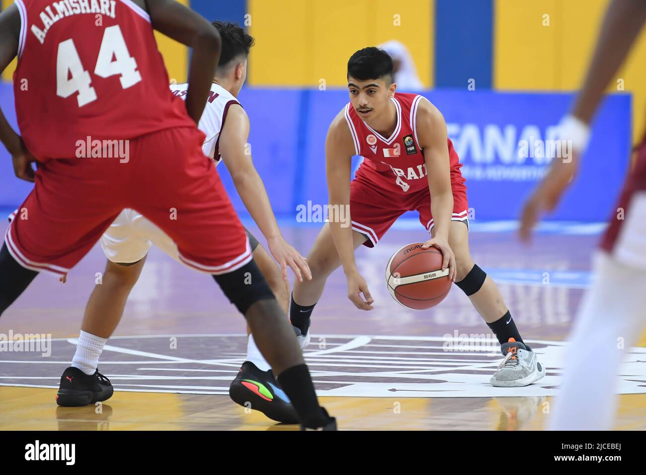 Doha, Qatar. 12th June, 2022. Mohamad Ramadhan (R) of Brunei Basketball