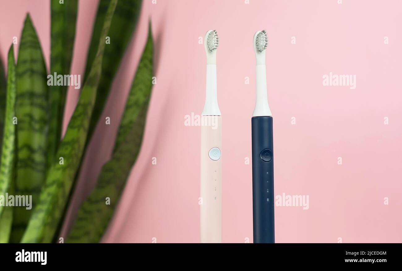 New modern ultrasonic toothbrushes. Dental care supplies with green