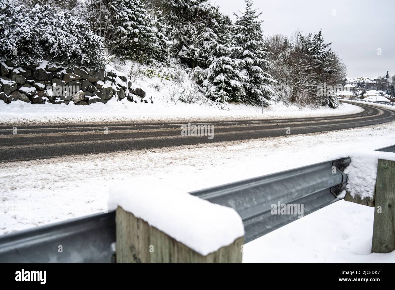 highway under snow conditions with a guard rail Stock Photo