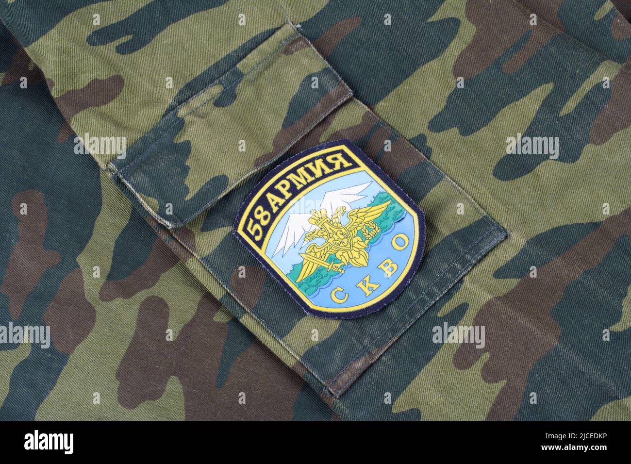 KYIV, UKRAINE - Feb. 25, 2017. Russian Army North Caucasus Military District uniform badge '58th Army' on camouflage unoform background Stock Photo