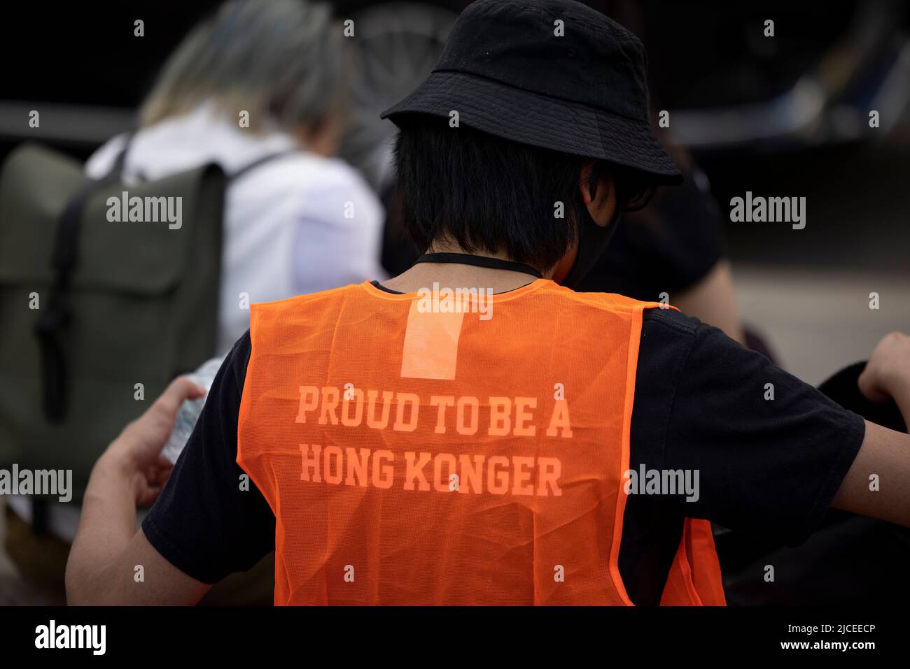 London, UK. 12th June, 2022. A volunteer is seen wearing a t-shirt with 'proud to be a Hongkonger' during the rally at Parliament Square. Thousands of Hongkongers in London gather on the 3rd anniversary of the pro-democratic anti-ELAB social movement in Hong Kong in memory of those who are died, jailed, and in exile because of the movement. The rally is the biggest gathering to date of Hongkongers in London since 2019 when the pro-democratic movement started in Hong Kong. Credit: SOPA Images Limited/Alamy Live News Stock Photo