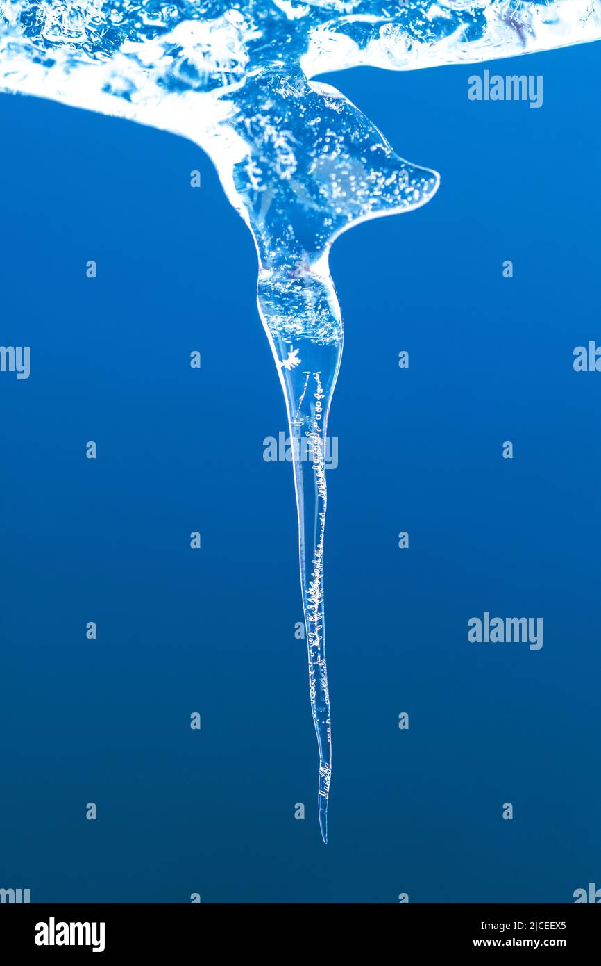 melting ice formation with a blue background Stock Photo