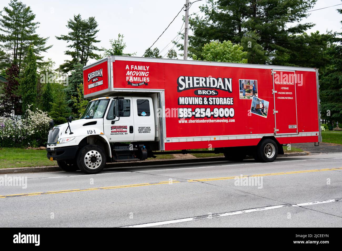A bright red Sheridan Bros. Moving and Storage moving van from Rochester, NY parked in Speculator, NY USA Stock Photo