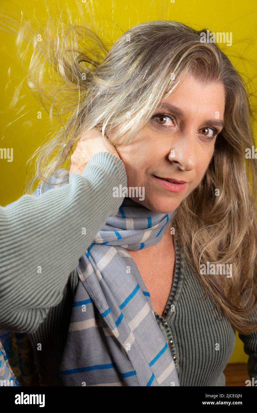 Portrait of a woman against yellow background. Salvador Bahia Brazil. Stock Photo
