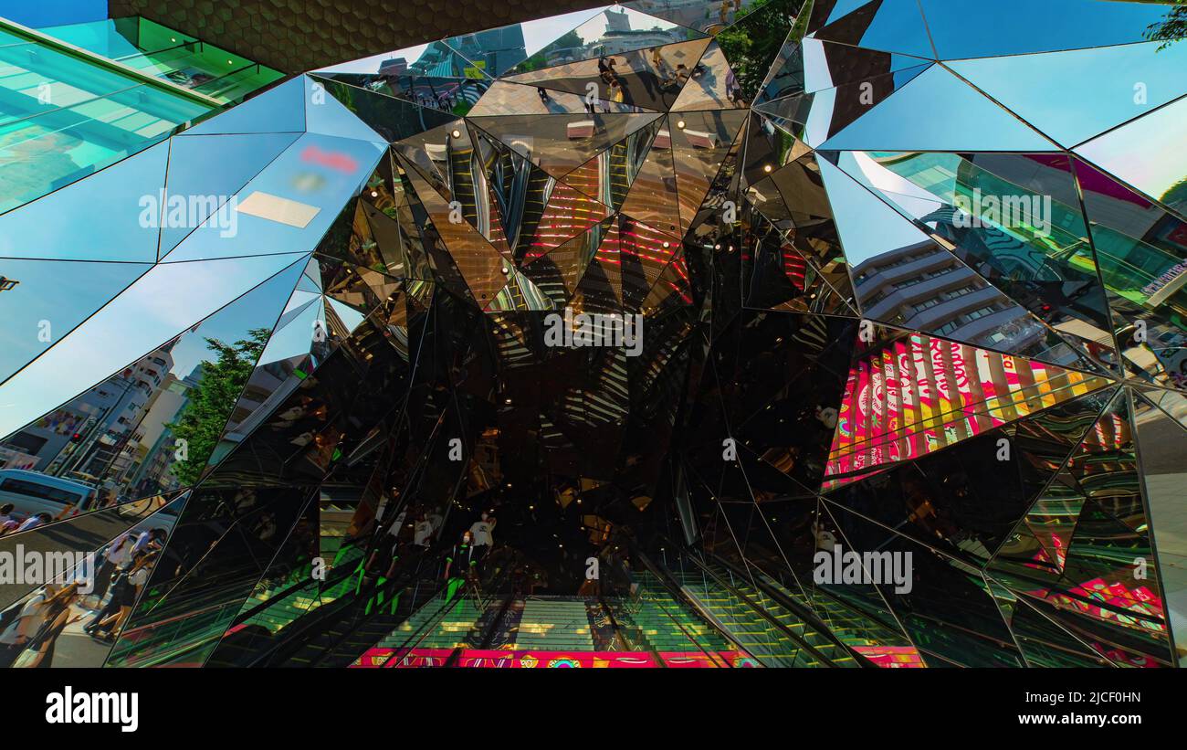 A timelapse of many people at mirror stairs in Harajuku Tokyo tilt ...