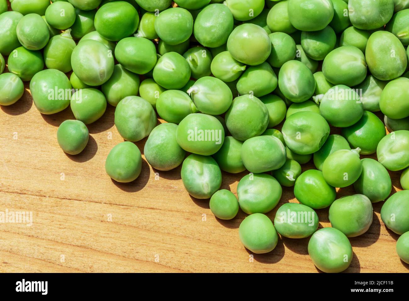 Close up view of fresh raw peas. Healthy organic green raw peas Stock
