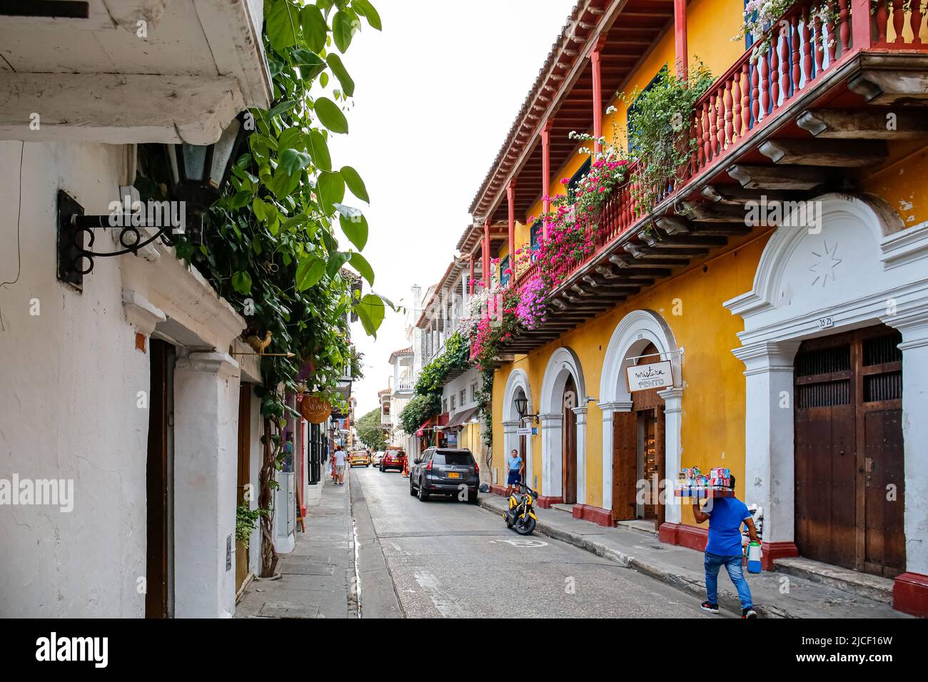 Typical colonial street with beautiful decorated, colorful buildings in Cartagena, Colombia Stock Photo