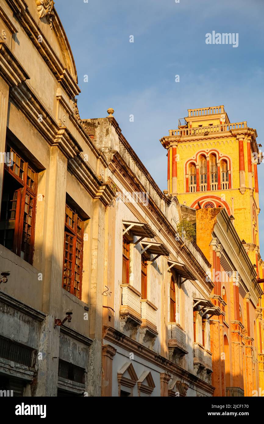 View to colonial buildings and church in warm light, Cartagena, Colombia Stock Photo