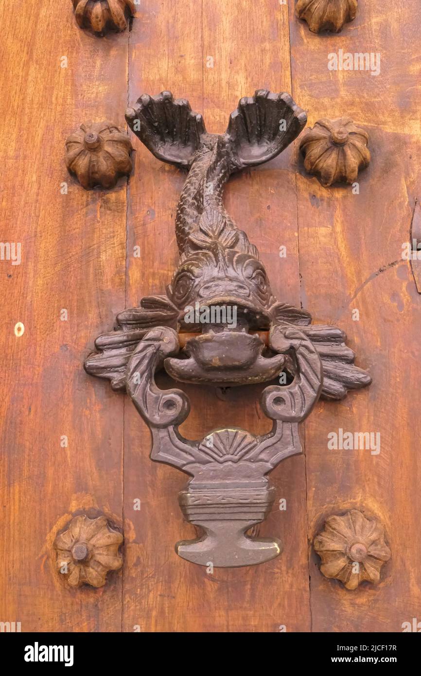 Close-up of traditional door knocker on wooden door in Cartagena, Colombia Stock Photo