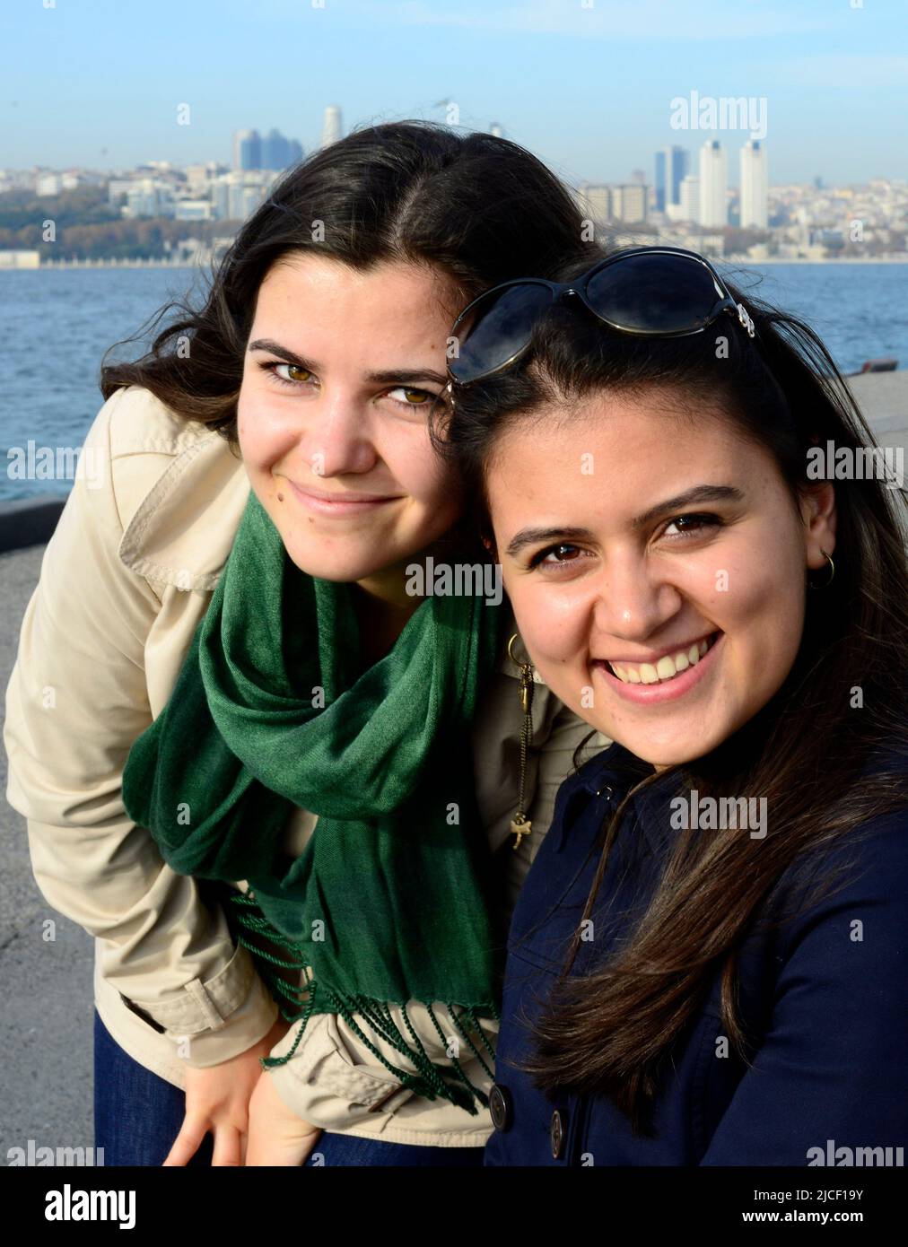 Beautiful young Turkish women posing of a picture by the Bosphorus straits in Istanbul, Turkey. Stock Photo