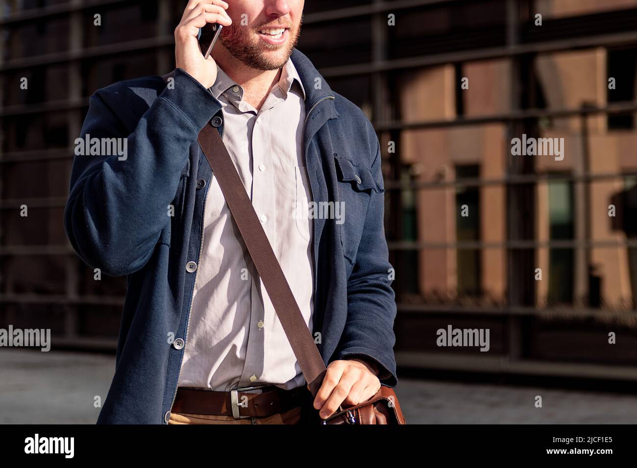 unrecognizable businessman talking by phone Stock Photo