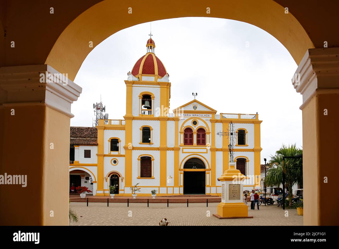 View through an arch to a colonial church in Santa Cruz de Mompox, Colombia, World Heritage Stock Photo