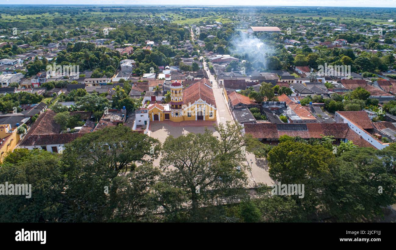 Close-up aerial view of the historic town Santa Cruz de Mompox and church of Saint Barbara at Magdalena river Stock Photo